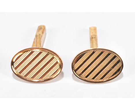 A pair of 9ct yellow gold cufflinks with engraved detail to the oval platforms,&nbsp;approximately 10.5g.&nbsp;Additional Inf