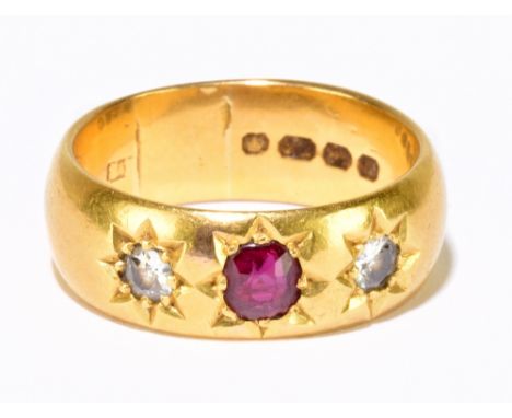 An 18ct yellow gold broad ruby and diamond three stone ring, ring size O, approx. 9.9g.Additional InformationSome light surfa