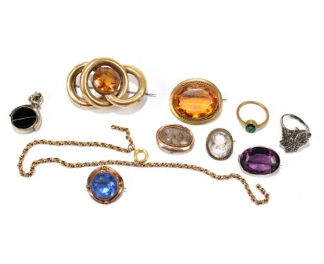 A group of brooches including a mourning brooch inscribed 'E. Hurly 1809', various other brooches and a section of a yellow m