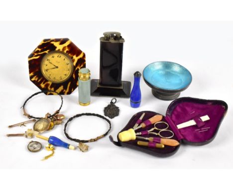 An early 20th century Continental silver and blue enamel bottle shaped case (chipped), with a similar cigarette holder, a gil