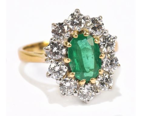 A 18ct gold emerald and diamond cluster ring, ring size N, approx. weight 5.7g&nbsp;