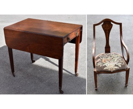 A 19th century mahogany drop-leaf Pembroke table with single end drawer and turned column supports terminating on castors alo