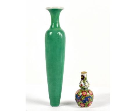 A Chinese porcelain bottle vase with blue seal to the underside, height 16cm, together with a Chinese porcelain miniature dou