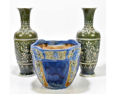 DOULTON LAMBETH; a pair of late 19th century Art Ware vase tubeline with stylised scrolling on onyx celadon ground, height 32
