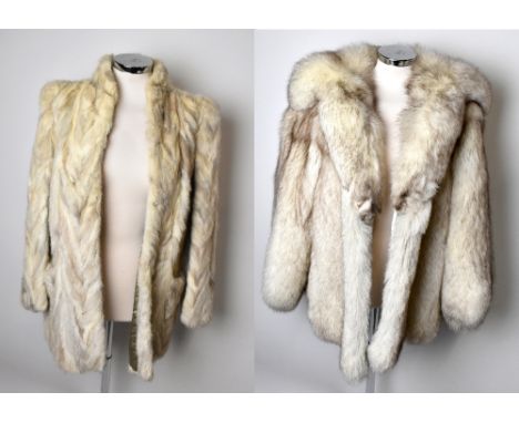 A short cream fox fur jacket with cuffed arms, a large collar and lined with embroidered satin, and a short cream fur jacket 