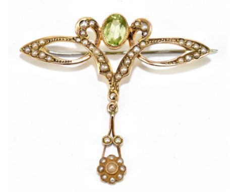 An early 20th century 9ct yellow gold seed pearl and green peridot Art Nouveau bar brooch, length 42mm, the drop 40mm, approx