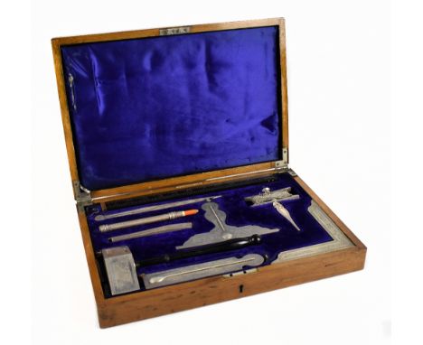 MASONIC INTEREST; GEORGE KENNING & SON, LONDON; an oak cased flat working tool box completely fitted with nine tools, with in