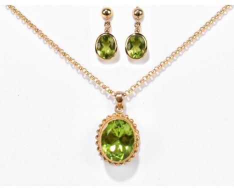 A 9ct yellow gold rope twist set green peridot suspended on a belcher chain, length of chain 46cm, and a matching pair of 9ct