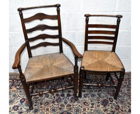 A harlequin set of 19th century and later Macclesfield oak ladder back chairs, with rush seats, including two with arms, (8)A