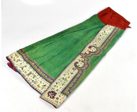 A Chinese embroidered Mamianqun, hand embroidered with silk panels decorated with flowers and insects, with a pleated central