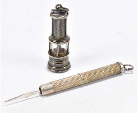 A late Victorian silver novelty seal modelled as a miner’s lamp, with blood stone matrix, length 3.5cm, with a silver toothpi