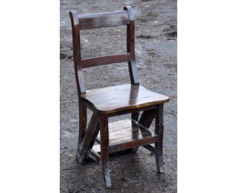 A reproduction metamorphic chair/ladder.