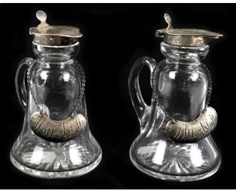 A pair of George V hallmarked silver mounted glass whisky noggins, Birmingham 1922, height 11cm, with a pair of engraved silv
