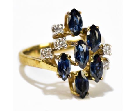 A 9ct yellow gold dress ring, set with five tiny diamonds and dark blue coloured stones, ring size K 1/2, approx. 4.3g.Additi