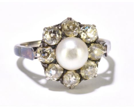 An 18ct white gold diamond and cultured pearl daisy head ring, the central pearl measuring approximately 6.5mm, with eight ol