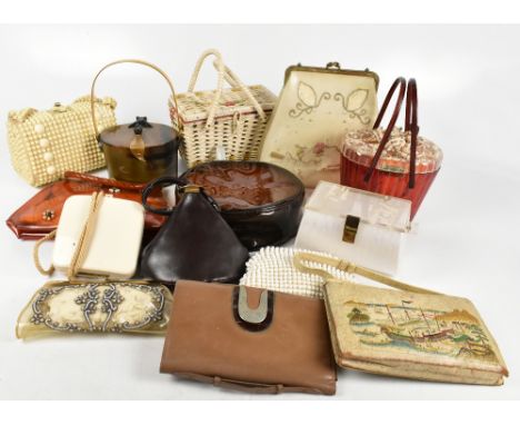 Fourteen vintage handbags to include a 1945 Lucite bag by Theresa Lyndhurst made from tortoiseshell Perspex with shells to to