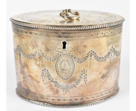 JAMES YOUNG; a George III hallmarked silver oval tea caddy with engraved detailing and engraved armorial with Latin inscripti