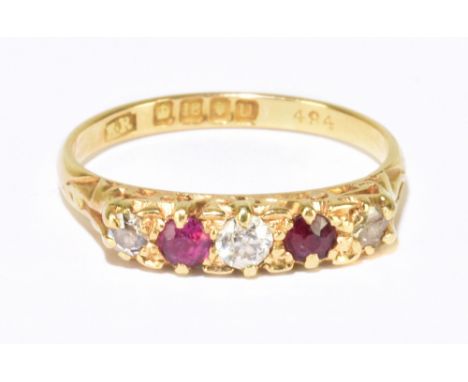 An 18ct yellow gold ruby and diamond five stone ring in elaborate scroll mount, ring size M 1/2, approx. 2.7g.&nbsp;Additiona