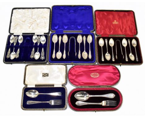 A set of six late Victorian hallmarked silver tea spoons and matching sugar tongs, with floral repoussé bowls, Birmingham 189