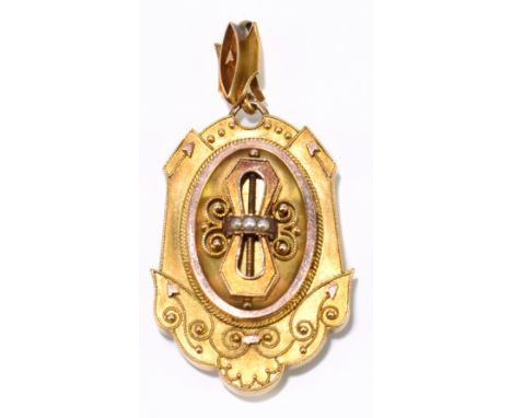 A late Victorian yellow metal locket, with filigree detail to the front and with hinged oval compartment to the reverse, leng
