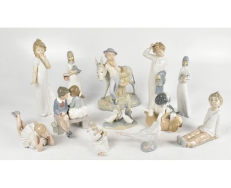 NAO; a collection of nine ceramic figures and model groups, including a boy and girl in night clothes height 28cm and 27cm an