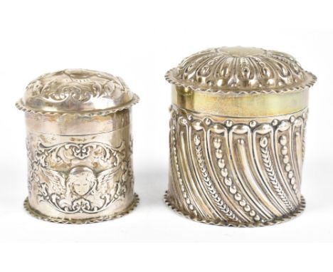 WILLIAMS COMYNS; a Victorian hallmarked silver cylindrical box and cover, decorated with Reynolds angels, height 7cm, diamete