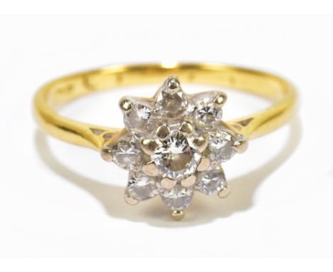 BOODLE &amp; DUNTHORNE; an 18ct yellow gold and diamond floral cluster ring, the central diamond weighing approx 0.15ct withi