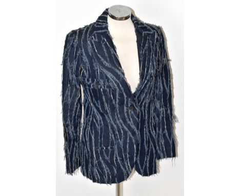 CHRISTIAN DIOR; an unusual fitted denim blazer with elasticated perforations, two front buttons, two front pockets and a larg