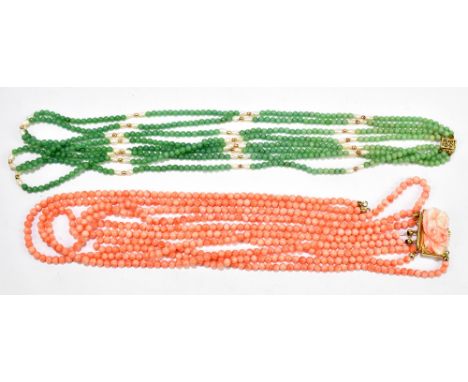 A five strand coral bead necklace with gilt metal clasp and a jade coloured and pearl multi strand necklace.Additional Inform
