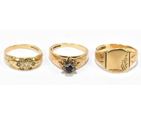 Three 9ct yellow gold rings, comprising a signet ring, size U, approx 4.1g, a sapphire ring, size P, approx 3.49g, and a pear