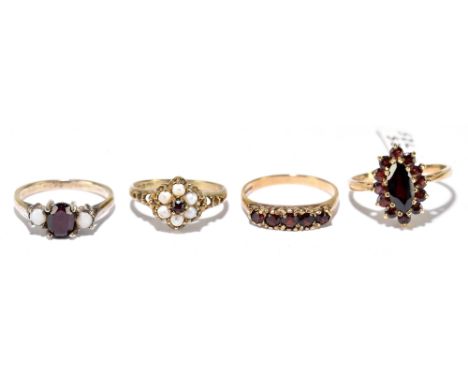 Four 9ct yellow gold dress rings set with garnets, pearls and opals, sizes M, L, L 1/2 and O 1/2, combined approx. 8.9g (4).