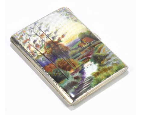 A George V hallmarked silver and enamelled cigarette case of rectangular form, decorated with a cottage in a landscape with r