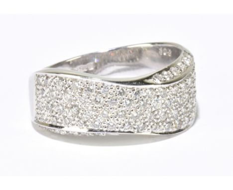 A platinum and diamond pave set broad crossover dress ring, size R, approx. 10g.&nbsp;Additional InformationMinor surface scr