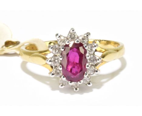 An 18ct yellow gold ruby and diamond oval claw set ring, size M, approx. 4.5g.Additional InformationThe ring head is 11.5 x 9