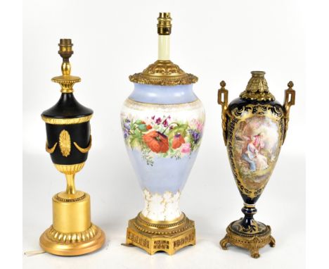 A late 19th century porcelain and gilt metal mounted twin handled table lamp, possibly Sevres, painted to the front with an o