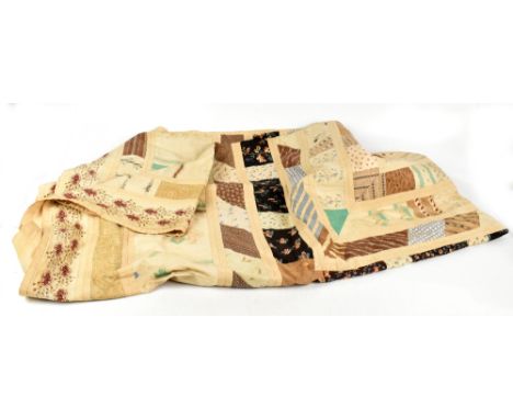 A Victorian c1874 handmade large patchwork quilt bedspread made up of individual squares of multi-coloured cottons and backed