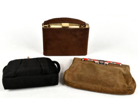 Three vintage handbags including a 1950s Minois France black silk vanity bag, containing a lipstick case, perfume bottle and 