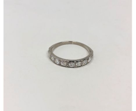 An antique platinum half eternity ring, the total diamond weight estimated at 0.90 carat, size N1/2