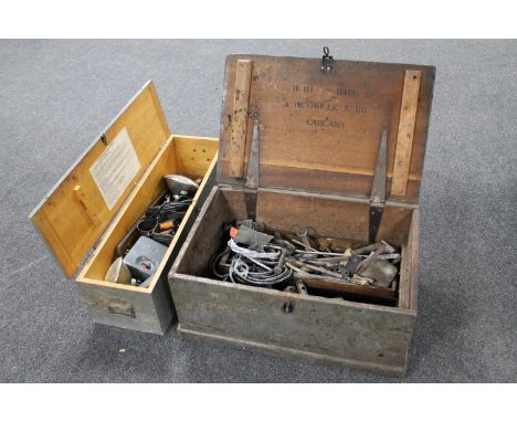 Two twentieth century pine storage boxes containing a large quantity of vintage hand tools, car headlights etc