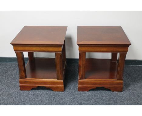 A pair of contemporary lamp tables in a mahogany finish  