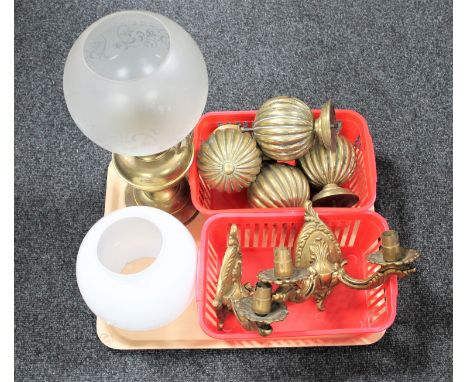 A tray of brass oil lamp with glass shade, opaque glass shade, set of four antique brass finial's and pair of brass wall ligh