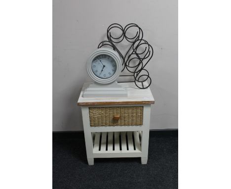 A pine bedside table fitted with a drawer together with a contemporary battery operated mantel clock and wrought iron wine ra