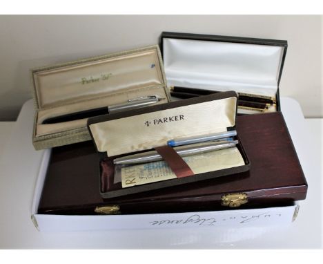 A box of containing a set of twelve Chinese Zodiac coins, Harmonica, cased Parker pens etc 