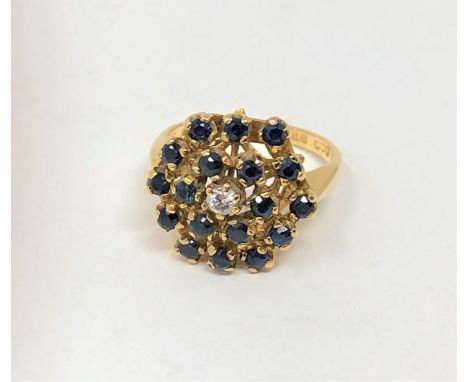 An 18ct gold sapphire and diamond cluster ring 