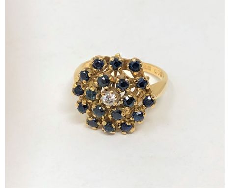 An 18ct gold sapphire and diamond cluster ring 