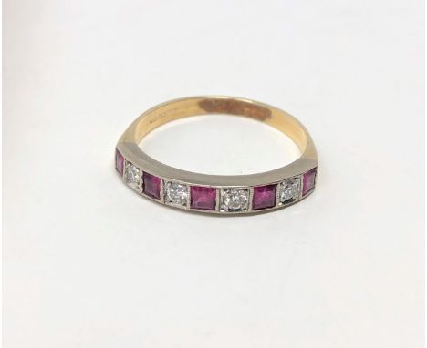 An 18ct gold ruby and diamond half eternity ring, size O