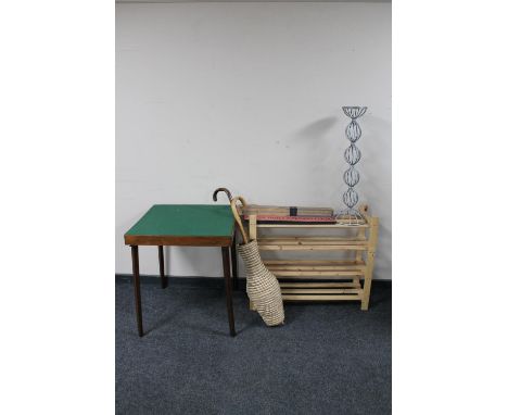 A set of pine shelves together with folding card table, wicker stick pot, two sticks and metal candle holder 