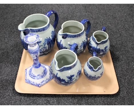 A tray of five blue and white ironstone graduated jugs and a Copeland Spode Italian candlestick 