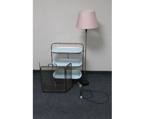 A mid 20th century metal framed three tier serving trolley with lift off trays together with a three way folding spark guard 