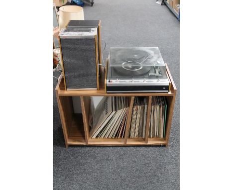 A Bush mid twentieth century record player with speakers on teak effect stand together with a large quantity of LP's 